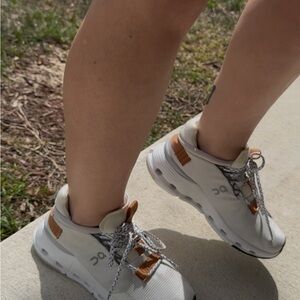 On Running White Sneakers with Brown Accents